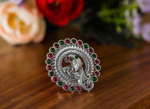 Here Is A Pretty Traditional Looking Ring In Silver Color In Oxidize Material. This Pretty Ring Is Beautified With Multi Color Stone Work And You Can Pair This Up With Any Colored Traditional Attire. Buy Now.