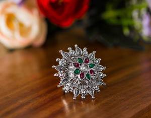 Here Is A Pretty Traditional Looking Ring In Silver Color In Oxidize Material. This Pretty Ring Is Beautified With Multi Color Stone Work And You Can Pair This Up With Any Colored Traditional Attire. Buy Now.