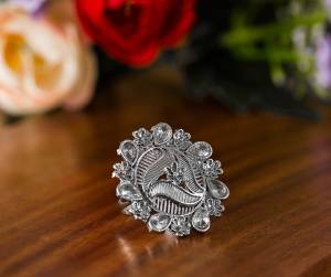 Here Is A Pretty Traditional Looking Ring In Silver Color In Oxidize Material. This Pretty Ring Is Beautified With Multi Color Stone Work And You Can Pair This Up With Any Colored Traditional Attire. Buy Now.