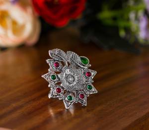 Here Is A Pretty Traditional Looking Ring In Silver Color In Oxidize Material. This Pretty Ring Is Beautified With Multi Color Stone Work And You Can Pair This Up With Any Colored Traditional Attire. Buy Now.