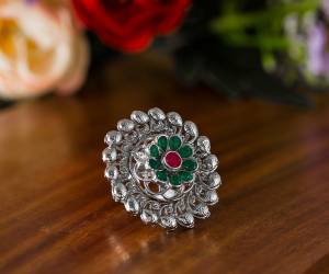 Here Is A Pretty Traditional Looking Ring In Silver Color In Oxidize Material. This Pretty Ring Is Beautified With Multi Color Stone Work And You Can Pair This Up With Any Colored Traditional Attire. Buy Now.