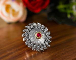 Here Is A Pretty Traditional Looking Ring In Silver Color In Oxidize Material. This Pretty Ring Is Beautified With Multi Color Stone Work And You Can Pair This Up With Any Colored Traditional Attire. Buy Now.