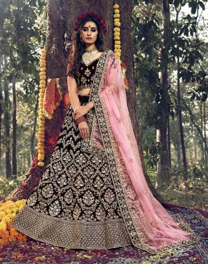 Here Is A Very Beautiful Heavy Designer Lehenga Choli For Bridal Wear In Dark Maroon Color Paired With Baby Pink Colored Dupatta. Its Blouse, Lehenga And Dupatta Are Beautified with Attractive Jari Embroidery And Stone Work. 