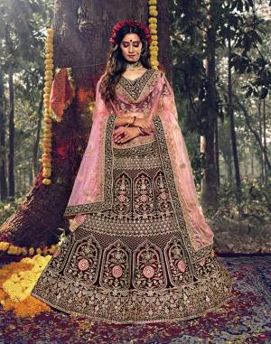 Here Is A Very Beautiful Heavy Designer Lehenga Choli For Bridal Wear In Dark Maroon Color Paired With Baby Pink Colored Dupatta. Its Blouse, Lehenga And Dupatta Are Beautified with Attractive Jari Embroidery And Stone Work. 