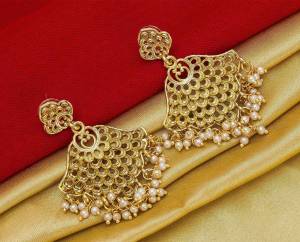 Here Is A Pretty Elegant Looking Heavy Designer Pair Of Earrings In Golden Color Beautified With Pearl Work. You Can Pair This Up With Any Colored Traditional Attire. 