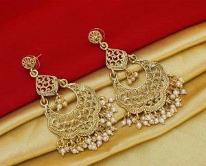 Here Is A Pretty Elegant Looking Heavy Designer Pair Of Earrings In Golden Color Beautified With Pearl Work. You Can Pair This Up With Any Colored Traditional Attire. 