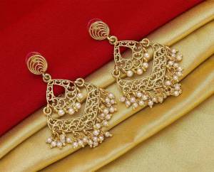 Here Is A Pretty Elegant Looking Heavy Designer Pair Of Earrings In Golden Color Beautified With Pearl Work. You Can Pair This Up With Any Colored Traditional Attire. 