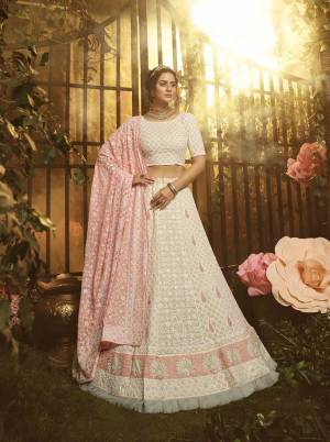 Grab This Very Beautiful Heavy Designer Lehenga Choli In Off-White color Paired With Peach Colored Dupatta. This Pretty Heavy Embroidered Lehenga, Choli And Dupatta Are Fabricated On Georgette. Buy This Pretty Piece Now.