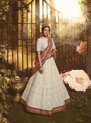 Grab This Very Beautiful Heavy Designer Lehenga Choli In White color Paired With Pink Colored Dupatta. This Pretty Heavy Embroidered Lehenga Choli Are Fabricated On Georgette Paired With Net Fabricated Dupatta. Buy This Pretty Piece Now.