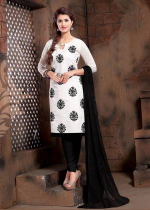 Add This Pretty Dress Material To Your Wardrobe In White Colored Top Paired With Black Colored Bottom And Dupatta. Its Top Is Modal Silk Based Paired With Cotton Bottom And Chiffon Fabricated Dupatta. 