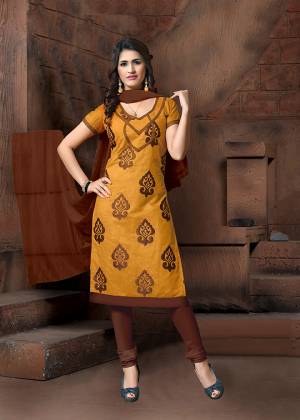 For Your Casual Or Semi-Casual Wear, Grab This Designer Straight Suit In Occur Yellow Color Paired With Contrasting Brown Colored Bottom And Dupatta. Its Top Is Fabricated On Modal Silk Paired With Cotton Bottom And Chiffon Fabricated Dupatta. 