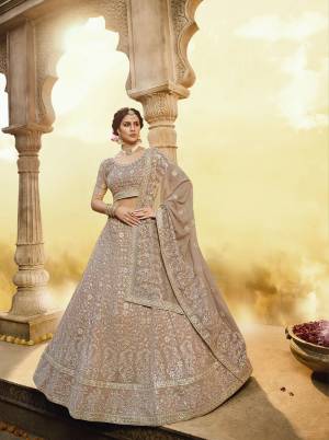 New And Unique Dusty shade Is Here With This Heavy Designer Lehenga Choli In Pastel Brown Color. Its Blouse And Lehenga Are Georgette Based Paired With Georgette Fabricated Dupatta. 