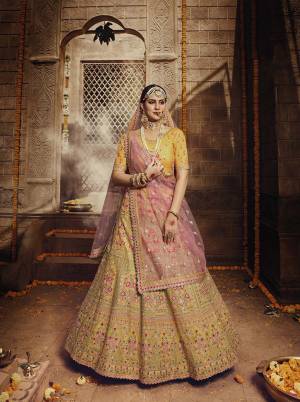 Rich And Elegant Looking Heavy Designer Lehenga Choli Is Here In Yellow Color Paired With Baby Pink Colored Dupatta. This Pretty Lehenga Choli Is Orgenza Based Paired With Net Fabricated Dupatta. Buy Now.