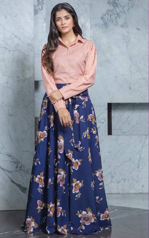 Look Pretty In This Trendy Pair Of Skirt And Top In Dusty Pink Colored Top Paired With Blue Colored Printed Skirt. Its Top Is Cotton Based Paired With Crepe Fabricated Skirt. Buy Now.