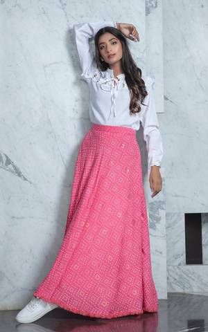 Grab This Pretty Readymade Designer Skirt Top In White Colored Top Paired With Pink Colored Skirt. Its Plain Top Is Fabricated On Cotton Paired With Rayon Fabricated Printed Skirt. 