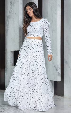 Grab This Pretty Readymade Designer Skirt Top In White Colored Top Paired With White Colored Skirt. Its Plain Top Is Fabricated On Crepe Paired With Crepe Fabricated Printed Skirt. 