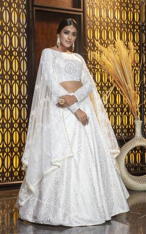 Adorn The Pretty Angelic Look, Wearing This Elegant all Over White Colored Designer Lehenga Choli. This Lehenga Choli Is Cotton Based Paired With Net Fabricated Dupatta. It Is Light In Weight And Easy To Carry All Day Long. 