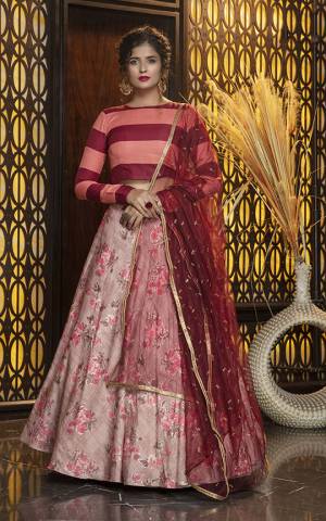 Add This Colorful Designer Lehenga Choli In Maroon And Peach Colored Blouse Paired With Dusty Pink Colored Lehenga And Maroon Colored Dupatta. Its Pretty Blouse Is Cotton Based Paired With Rayon Lehenga And Net Fabricated Dupatta. All Its Fabric Are Light Weight And Ensures Superb Comfort All Day Long. 