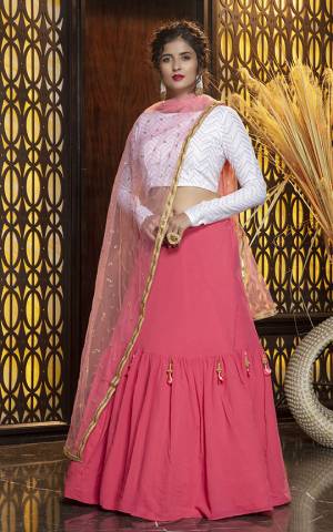 Look Pretty In This Subtle Color Pallete Lehenga Choli In White Colored Blouse Paired With Pink Colored Dupatta. Its Blouse Is Cotton Based Paired With Georgette Fabricated Lehenga And Net Fabricated Dupatta. 