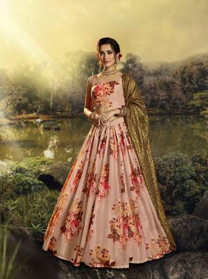 You Will Definitely Earn Lots Of Compliments Wearing This Designer Printed Lehenga Choli In Peach Color Paired With Golden Colored Dupatta. This Lehenga Choli Is Orgenza Based Paired With Georgette Fabricated Sequence Embroidered Dupatta. 