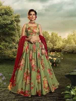 You Will Definitely Earn Lots Of Compliments Wearing This Designer Printed Lehenga Choli In Green Color Paired With Red Colored Dupatta. This Lehenga Choli Is Orgenza Based Paired With Georgette Fabricated Sequence Embroidered Dupatta. 