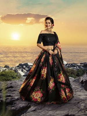 Celebrate This Festive And Wedding Season Wearing This Trendy Designer Lehenga Choli In Sequence Embroidered Black Colored Blouse Paired With Black Colored Lehenga And Dupatta Which Is Beautified With Pretty Floral Prints. 