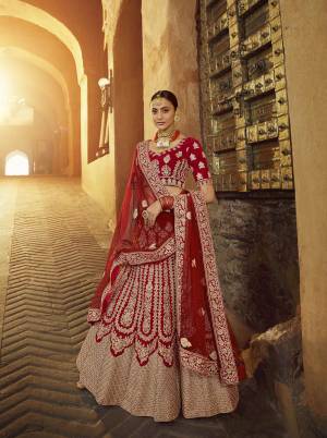 Get Ready For Your D-Day With This Heavy Designer Lehenga Choli In All Over Red Color. This Heavy Embroidered Lehenga Choli Is Fabricated On Velvet Paired With Net Fabricated Dupatta. It Is Beautified With Heavy Coding Jari Embroidery. Buy This Bridal Lehenga Now.