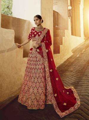 Get Ready For Your D-Day With This Heavy Designer Lehenga Choli In All Over Red Color. This Heavy Embroidered Lehenga Choli Is Fabricated On Velvet Paired With Net Fabricated Dupatta. It Is Beautified With Heavy Coding Jari Embroidery. Buy This Bridal Lehenga Now.