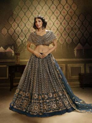 Here Is Lovely Heavy Trendy Designer Lehenga Choli In Teal Blue Color. This Pretty Lehenga, Choli And Dupatta Are Fabricated On Net Beautified With Jari Embroidery And Sequence Work. Buy Now. 