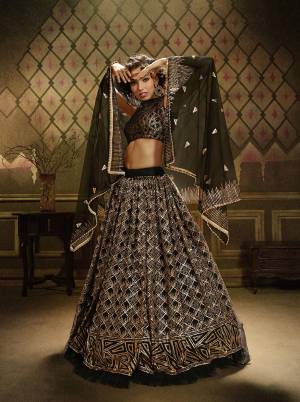 Get Ready For This Wedding Season Wearing This Heavy Designer Lehenga Choli In Black Color. This Beautiful Heavy Embroidered Lehenga Choli Is Fabricated On Net Beautified With Jari Embroidery And Sequence Work. 