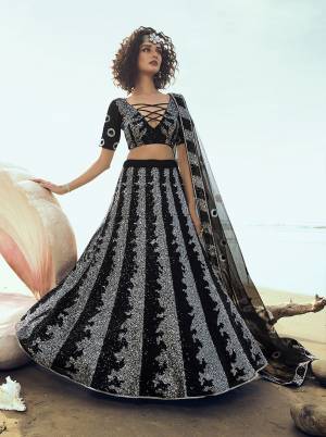 For A Bold And Beautiful Look, Grab This Attractive Looking Heavy Designer Lehenga Choli In Black Color. This Lehenga Choli And Dupatta Are Fabricated On Net With Attractive Sequence Work. 