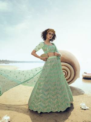 Look Pretty Wearing This Heavy Embroidered Lehenga Choli In Pastel Green Color. This Pretty Lehenga, Choli And Dupatta Are Fabricated On Net Beautified With Heavy Sequence Work. Its Pretty Color And Embroidery Will Earn You Lots Of Compliments From Onlookers. 