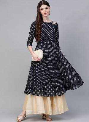 Add This Beautiful Readymade Kurti In Navy Blue Color Fabricated On Crepe Beautified With Prints. It Is Light Weight and Available In All Regular Sizes. 