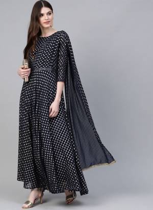 Add This Beautiful Readymade Kurti In Navy Blue Color Fabricated On Georgette Beautified With Prints. It Is Light Weight and Available In All Regular Sizes. 